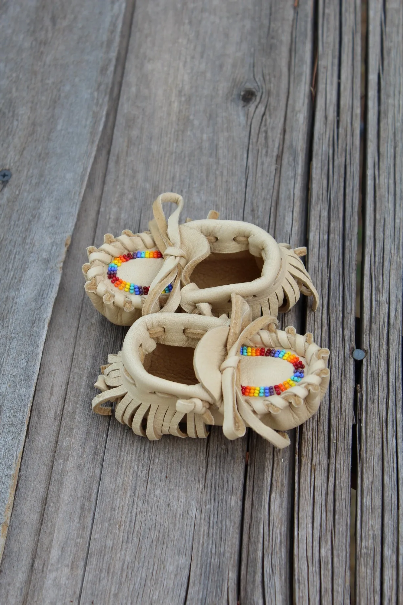 Beaded baby moccasins, fringed moccasins